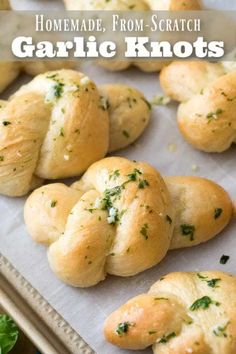 garlic knots on a baking sheet with text overlay that reads homemade, from scratch garlic knots