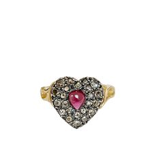 a heart shaped ring with diamonds and a pink stone in the center on a white background