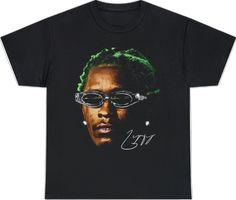 a black t - shirt with an image of a man wearing glasses and green hair