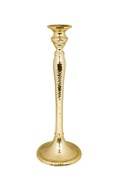 a gold candle holder on a white background