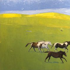 three horses running in a green field