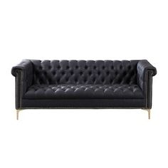 a black leather couch with studding on the armrests and back rests against a white background