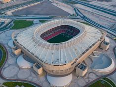 an aerial view of a soccer stadium with the roof covered in plastic sheeting and grass