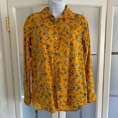 Old Navy Button Front Blouse Blue Floral On Yellow Background Size Small 100% Cotton Length 27" Underarm To Underarm 20" Sleeve Length 23" Fall Yellow Shirt With Floral Print, Yellow Blouse With Button Closure For Daywear, Yellow Collared Shirt With Floral Print, Yellow Buttoned Shirt For Daywear, Yellow Button-up Blouse For Work, Yellow Button-up Blouse With Button Closure, Collared Yellow Floral Print Tops, Yellow Collared Top With Floral Print, Yellow Floral Print Button-up Top