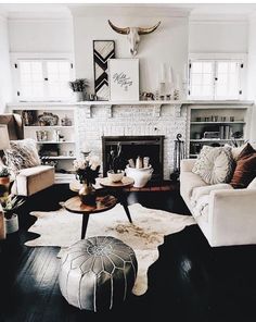 a living room filled with furniture and a fire place