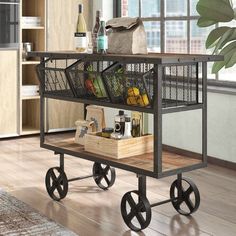 a kitchen cart filled with food and drinks on top of a hard wood floor next to a window