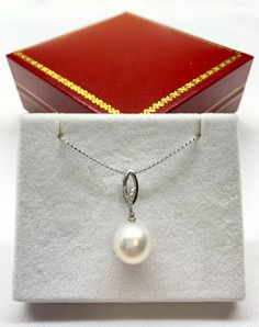 Australia White South Sea Pearl Pendant, 14K White Gold 12.6mm South Sea Pearl Pendant, Pearl has natural lightly belmishes, Pendant Only 030324-19 Metal stamp18k MetalWhite gold MaterialPearl, NA Gem TypeNA SettingOther-Type Length ChainNo chain ClaspNo Clasp Pearl Information Number of pearls 1 Surface markings and blemishes Blemished (As pictured) ShapeOval UniformityVery good LusterHigh-luster Minimum colorWhite Size per pearl12.7 mm Pearl typeSouth Sea cultured pearl About South Sea Pearl South Sea pearls are the largest and rarest of the cultured pearls - making them the most valuable. Prized for their exquisitely beautiful 'orient' or lustre, South Sea pearls are now farmed in various parts of the world where the Pinctada maxima oysters can be found, with the finest South Sea pearls White Brilliant Cut Pearl Necklace Gift, White Pearl Necklace With Brilliant Cut For Gifts, White Pearl Necklace For Gift, Elegant White Oval Pearl Necklace, Gold Gift, South Seas, Sea Pearls, South Sea Pearls, Golden Color