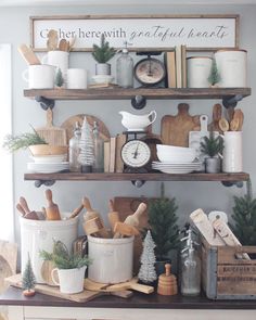 the shelves are filled with pots, pans and other kitchen utensil items