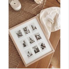 a wooden table topped with pictures next to a white vase and cloth on top of it