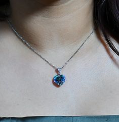 Beautiful Multifaceted Blue heart Swarovski Crystal necklace mounted on Sterling Silver 925. It is mounted on an 18-inch Sterling Silver 925 chain. You can select the size of the Adjustable Silver Chain   From 18"", 20"" & 22"" for FREE  Simply select your preferred length at checkout. Size - 1/1 inch (2.54cm height & width) Shape - Heart Colour - Blue Weight - 4.15 gram The chain is 925 Sterling Silver Please choose the length 18"", 20"", 22"" inches.  The necklace comes with a complimentary bo Blue Heart Pendant Jewelry Gift For Her, Blue Heart Pendant Clavicle Chain Jewelry, Sapphire Heart Pendant Necklace In Sterling Silver, Blue Clavicle Chain Necklace As A Gift For Her, Sapphire Sterling Silver Heart Pendant Necklace, Sterling Silver Heart Cut Sapphire Necklaces, Sterling Silver Sapphire Heart Cut Necklaces, Heart Cut Sapphire Sterling Silver Necklaces, Blue Heart Pendant Necklace As Gift For Her