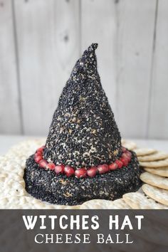 a witches hat made out of crackers on top of a plate with text overlay that reads, witches hat cheese ball