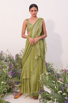 Green pre-stitched saree with ruffle trims. Paired with a padded blouse with floral hand embroidered straps. - Aza Fashions Green Fitted Pre-draped Saree For Summer, Elegant Georgette Pre-draped Saree For Spring, Elegant Pre-draped Georgette Saree For Spring, Spring Elegant Georgette Pre-draped Saree, Elegant Spring Georgette Pre-draped Saree, Fitted Green Pre-draped Saree For Summer, Fitted Georgette Pre-draped Saree For Spring, Fitted Pre-draped Saree For Festive Spring Occasions, Fitted Spring Festive Pre-draped Saree