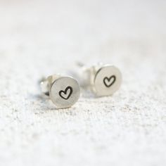 Sterling silver stud earrings with stamped hearts