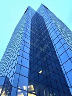 a very tall glass building with lots of windows