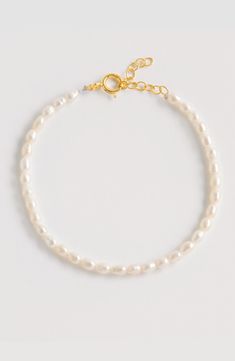 Elevate your designer jewelry collection with this beautiful rice pearl bracelet. Handcrafted from luxurious 18ct Gold vermeil-plated Sterling Silver and rice pearls, this lightweight statement pearl bracelet is timeless, perfect for a bride-to-be or gifting for her. A fabulous day to night bracelet to add a touch of glamour and style. Adjustable length bracelet made from Rice Pearls & 18ct yellow gold plated sterling silver. Maximum length: 21.5cm / 81/2" Minimum length: 18cm / 7". Rice Pearls, Designers Jewelry Collection, Pearl Bracelets, White Bracelet, Wedding Engagement Gifts, White Bracelets, Mens Eyewear, Designer Jewellery, Designer Clothes For Men