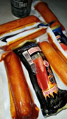 hotdogs and other condiments are laid out on the counter top, ready to be eaten