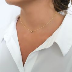 "Dainty Gold Choker Necklace For Women with a 5mm Ball Bead Pendant ◾ Length - 13\" + 3\" Extender chain ◾ Material - Gold-Filled ◾ Will not tarnish, Safe to use in regular water ◾ Handmade and finely detailed necklace, made with high-quality material Care Instructions The necklace is tarnish-resistant and waterproof, so you don't need to take it off before the shower :-) For cleaning - Wash with water and dish liquid or gently clean with a polishing cloth Avoid touch with lotion, perfume, or an Minimalist Everyday Choker With Round Beads, Minimalist Tiny Beads Choker For Gift, Minimalist Tiny Beads Choker As Gift, Gift Delicate Chain Choker With Round Beads, Minimalist Beaded Chain Choker For Gift, Minimalist Beaded Chain Choker As Gift, Minimalist Beaded Choker Necklace As Gift, Minimalist Tiny Bead Choker Necklace, Minimalist Beaded Choker Necklace For Gift