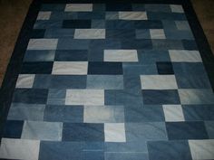 a blue and white rug with squares on it