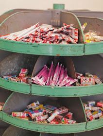 a green bin filled with lots of candy