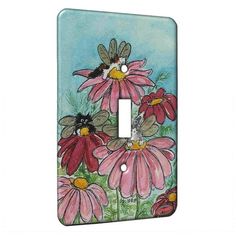 a light switch cover with flowers painted on it