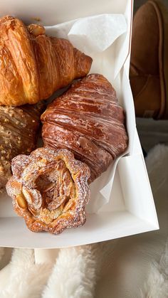 a box filled with different types of pastries