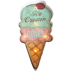 an ice cream cone sign with some lights on it's sides and the words ice cream cones