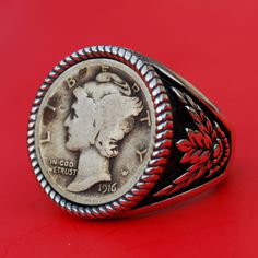 Splendid 925 Sterling Silver Signet Ring - Bank Note Olive Leaf Design. Hand-made. Antique style oxidized. The ring is set with a genuine US 1916 Strong Date Mercury Dime 90% Silver Coin. Great detail, nice depth, and beautiful contrast. I only use these coins with readable dates, never try to clean them, and always keep their collectible and numismatic values. I designed and made the ring. The ring is NEW and never used. Ring size: You need to pick a ring size from drop-down menu Target: Unisex Classic Engraved Nickel-free Ring, Classic Nickel-free Engraved Ring, Classic Nickel-free Engraved Round Ring, Vintage Antique Silver Signet Ring For Anniversary, Antique Silver Signet Ring For Commemoration, Classic Antique Silver Engraved Ring, Classic Stamped Jewelry For Memorial Occasion, Heirloom Silver Rings For Commemoration, Classic Antique Silver Stamped Rings