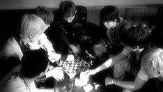 a group of young people playing chess together