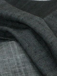 a close up view of a gray suit