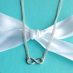 Tiffany Infinity Is A Powerful Symbol Of Continuous Connection, Energy And Vitality. The Addition Of Endlessly Looped Double Chains Echoes The Infinite Nature Of The Design. Sterling Silver On A Double 16" Chain Excellent Condition With Minimal Superficial Wear As Seen On Pictures Authentic Box/Pouch Not Included. Double Chain Necklace, Box Pouch, Infinity Pendant, Tiffany Co Jewelry, Double Chain, Tiffany & Co., Womens Jewelry Necklace, Size 16, Chain Necklace