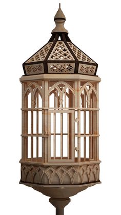 a wooden birdcage sitting on top of a pole