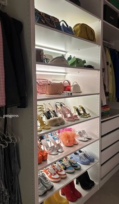 the closet is full of shoes and purses