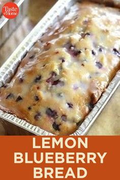 a loaf of lemon blueberry bread sitting on top of a wooden table