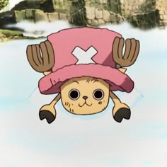 a cartoon character floating in the water wearing a pink hat