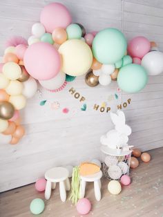 a room filled with balloons and other decorations