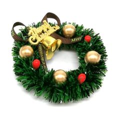 a christmas wreath with bells and ornaments on it