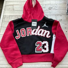 Girls Jordan 23 Hoodie Nwt Black Hooded School Hoodie, Black Hooded Hoodie For School, Winter School Fleece Tops, Fleece Tops For School In Winter, Red Cotton Hoodie For School, Black Sporty Sweatshirt For School, Red Long Sleeve Sweatshirt For School, Red Hooded Sports Top, Red Hooded Top For Sports Season