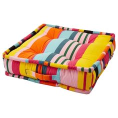 a dog bed with multicolored stripes on it