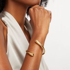 Expect to draw all the right kinds of attention with this sleek Soko Twisted Dash Cuff bracelet. Brass with 24K gold plate This bypass design subtly graduates to the widest open ends Adjustable style that flexes on and off for easy wear Handcrafted by artisans in Kenya using traditional techniques Creative Background, Traditional Techniques, Easy Wear, Kenya, Cuff Bracelet, To Draw, Jewelry Box, Gold Plate, Fine Jewelry