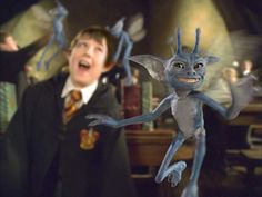 an animated character is in the air with other characters behind him, including harry potter