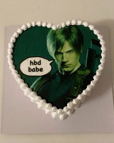 a heart shaped cake decorated with an image of star trek's spock