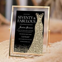 a black and gold wedding card with a dress on it