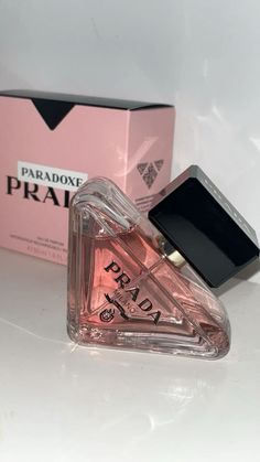 Prada Paradoxe is a captivating fragrance that embodies the complexities of modern femininity, blending elegance with a touch of boldness. Launched in a beautifully crafted bottle, its design reflects the paradoxical nature of the scent—sleek yet intricate, embodying both strength and softness. The fragrance opens with bright notes of bergamot and neroli, introducing a fresh and uplifting essence.  #FragranceAddict #PerfumeLover#SignatureScent#ScentOfTheDay#PerfumeCollection #FragranceGoals#LuxuryFragrance#PerfumeAddict#ScentedLifestyle #PerfumeObsessed#FragranceOfTheDay#PerfumeCommunity#SprayAndSlay #SmellGoodFeelGood#PerfumeGoals#FragranceLovers#PerfumeVibes#ScentStyle #FragranceJunkie#PerfumeHeaven Prada Paradoxe Perfume, Prada Perfume, Bath N Body Works, Sephora Skin Care, Celebrity Perfume, Perfume Scents, Perfume Design, Perfume Lover, Best Perfume