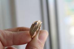 Alternative engagement ring, 14k solid gold leaf ring , Blue topaz ring Inspired by nature this leaf ring has been made from a real leaf using the lost wax method ,an ancient technique to create jewelry. The finish is matte ,but you can choose a shiny too. The leaf has been soldered in a delicate twig band ,for a total organic look and a 2mm blue topaz make this ring as an alternative engagement or wedding ring . Great gift for brides, nature ,botanical lovers . Such a pretty piece, great to go Elegant Leaf-shaped Anniversary Rings, Nature-inspired Recycled Gold Wedding Jewelry, Leaf-shaped Yellow Gold Wedding Jewelry, Leaf-shaped Yellow Gold Jewelry For Weddings, Handmade 14k Gold Sapphire Promise Ring, Leaf Wedding Ring, Engagement Ring Nature, Gold Leaf Ring, Leaf Wedding Rings