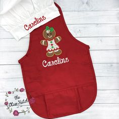 a red apron with a gingerbread girl on it and the words cookies written in white