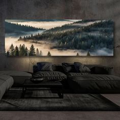 a living room with a large painting on the wall and couches in front of it