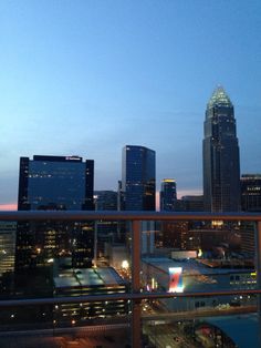 the city skyline is lit up at night