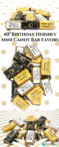 a table topped with lots of candy covered in gold confetti and black and white labels