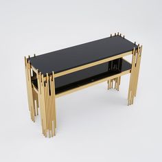 a black and gold console table with two shelves on each side, one shelf is open