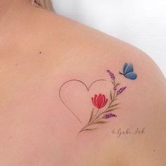 a woman's back with flowers and butterflies on her left shoulder, which has the word love written in it